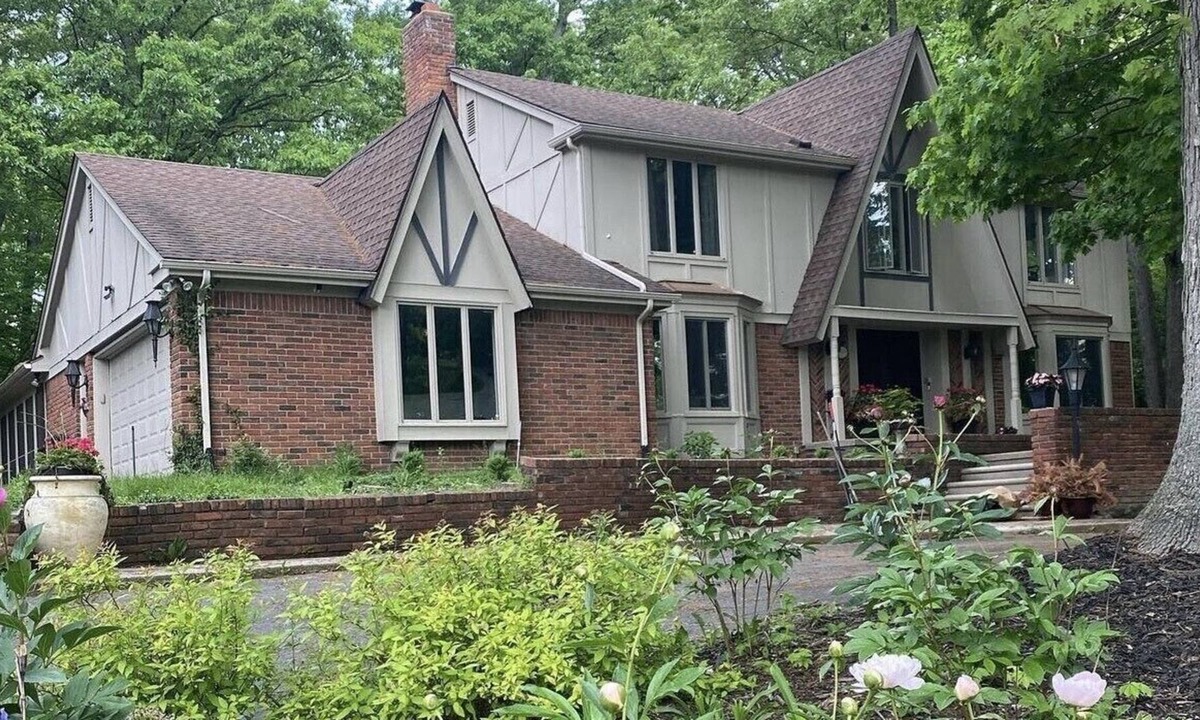 Farmington Hills House | Beautiful English Farmhouse Tudor, situated on a lush hillside acre.