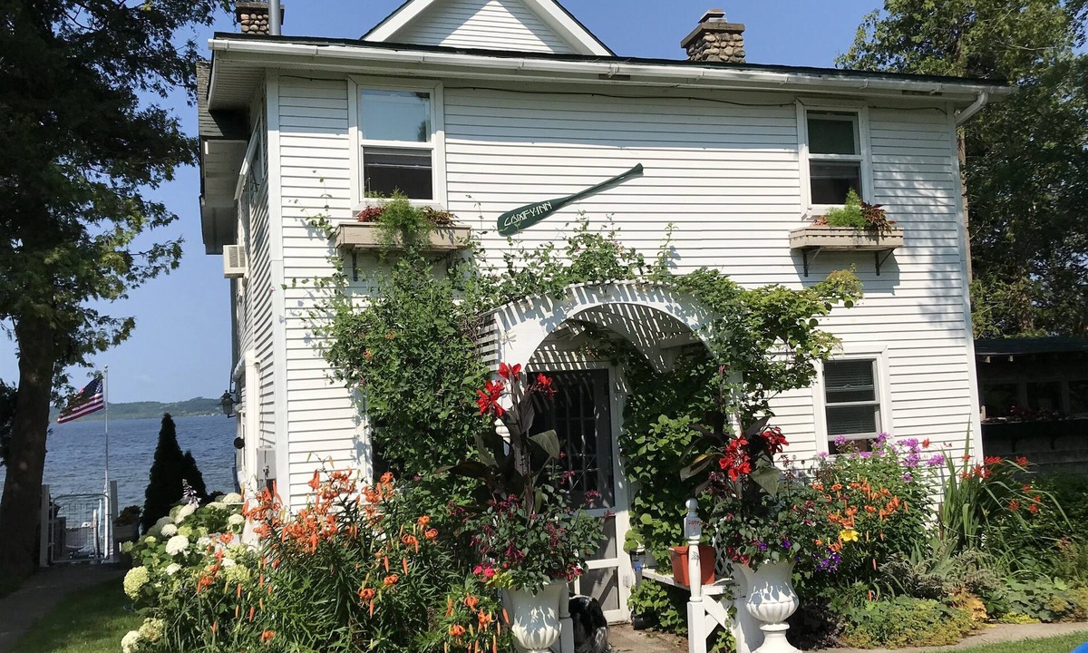 Traverse City Cottage | Charming, cozy cottage 10 feet from water's edge on Lake Leelanau.