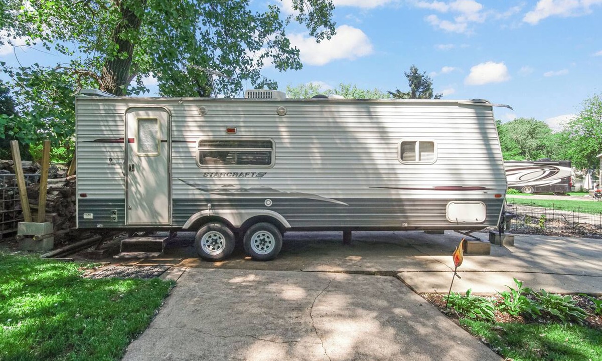 Portage House | MTM Premier Funky Wizard sleeps 4 in a whimsical travel trailer. Includes a queen bedroom, full bathroom, kitchen, and outdoor space for a fun, family-friendly campground getaway, just minutes from Indiana Dunes.