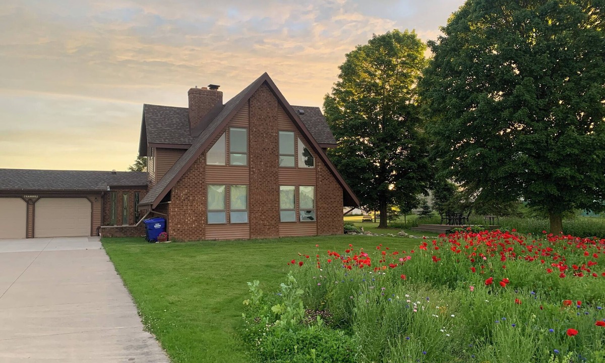 Oneida House | Our Thunder Moon Farm Stay- sleeps 7, framed by wildflowers. 4 miles to GB.
