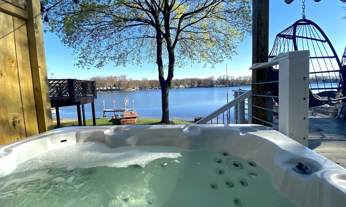 Plainwell House | Pine Lake Retreat- sparkling hot tub! Lakeside house with sandy lakefront!