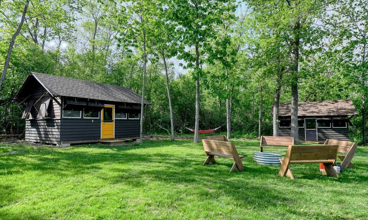 East Troy Cabin | Three Cozy Historic Scout Cabins with Fire Pit, BBQ, and Hammocks for a Memorable Family Adventure in Troy, Wisconsin