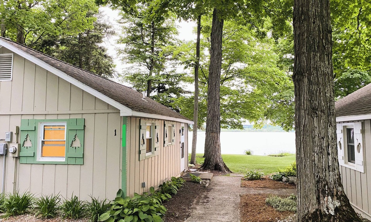 Traverse City Cottage | Waterfront directly on Lake Leelanau!Cottage with beach and fire pits!