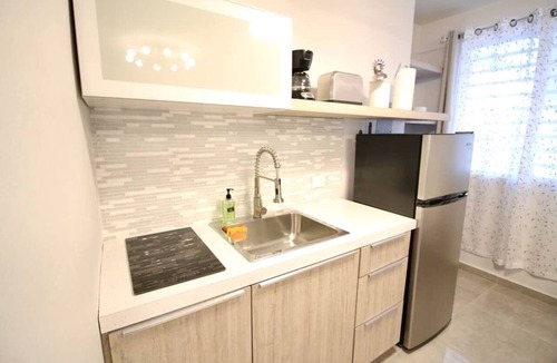 Mayaguez Pueblo Apartment | 1.5 Generator 2nd Floor Parking 1BR 396sf