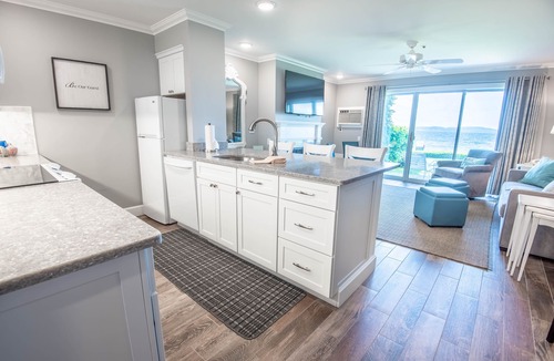 Boyne City Condo | 112 Water Street | Lake Charlevoix Views | Private Patio and Beach |