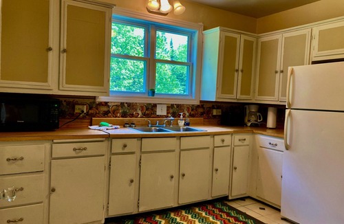 Manistique Cottage | 3BR/1.5BA Woodsy Stone Cottage 1 Hr to Pictured Rocks, Hike Trails On-Property