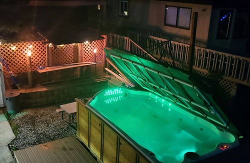 Grand Rapids Apartment | Campau Lake Escape |1 of 4 levels | Hot tub karaoke game room