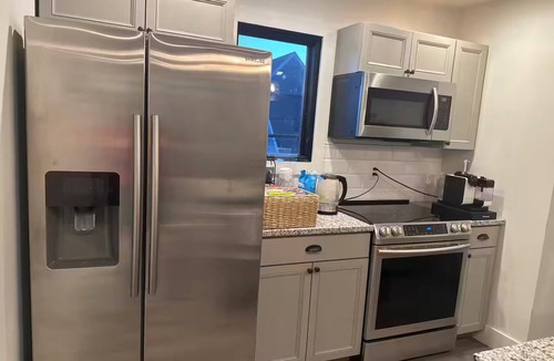 Kennedy King Apartment | Charming 1-bedroom carriage house apartment with private garage