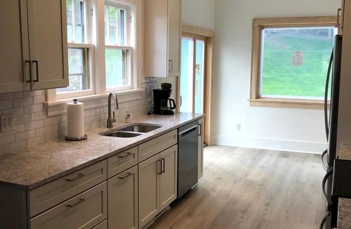Macatawa Cottage | Charming Waterfront Cottage with Modern Remodel Overlooking Lake Macatawa Harbor, Near Macatawa, Michigan