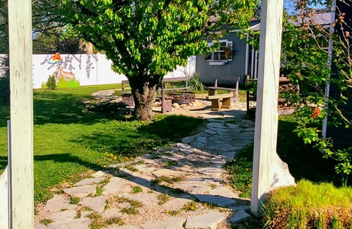 Three Oaks Cottage | Cherry Street Guesthouse with private wooded yard & firepit, 3 blocks to town!