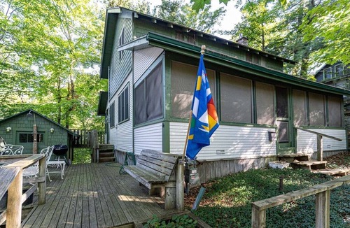 Grand Haven House | Classic Lake Cottage nestled in Wooded Dunes just