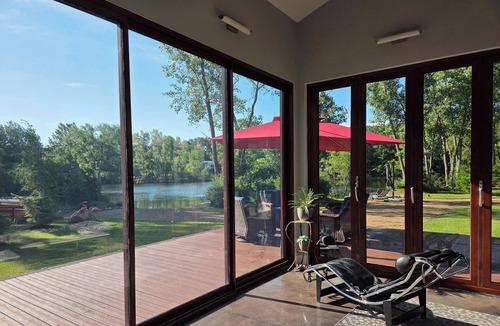 Stevensville House | Contemporary home, 4 wooded acres, 200' lakefront; Dock; Backyard; Lake lounge