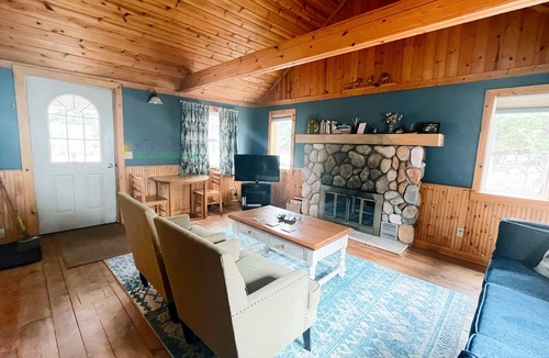 Glen Arbor House | Cottage in Glen Arbor with Crystal River frontage, canoe, FP, A/C, Dogs ok