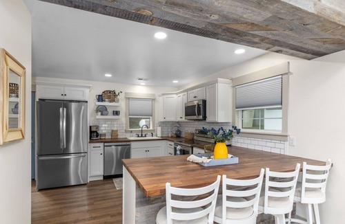 Greenville Cottage | Cottage on Wabasis Lake. Pets welcome. Pontoon, kayaks, SUP boards, hot tub!