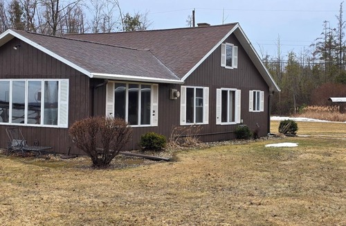 Shawano Cottage | Cozy lakefront home rests on Shawano Lake - swimming, fishing, boating, dock.