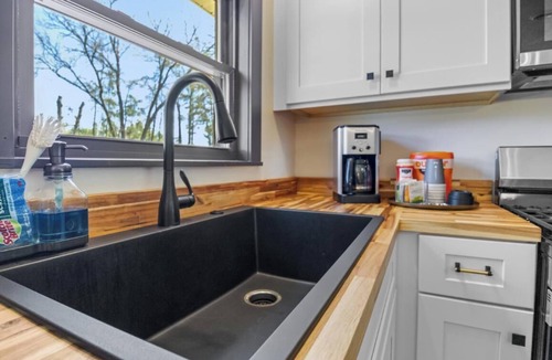 Irons House | Cozy Lodge on 10 acres- Sleeps 9, Newly Renovated, Game Room, Lg Deck, Irons MI.