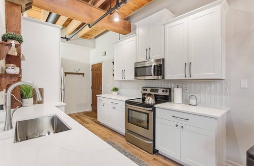 Grand Haven Condo | DOWNTOWN WATER VIEW PRIVATE BALCONY! 2 bedroom 1 bath w/large jacuzzi tub