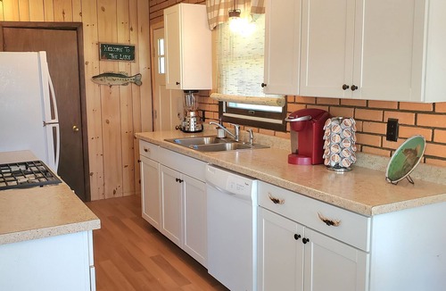 Sister Lakes House | Family Friendly Lakefront Whimsical Cottage with Pontoon Boat in Sister Lakes MI