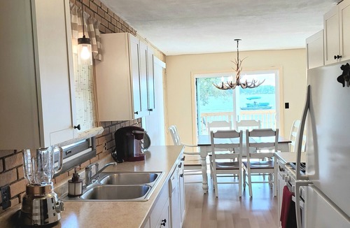 Sister Lakes House | Family Friendly Lakefront Whimsical Cottage with Pontoon Boat in Sister Lakes MI
