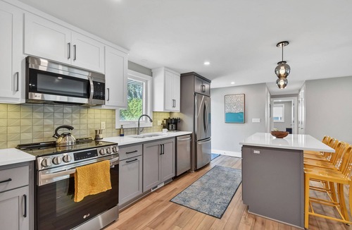 Green Bay House | FULL Remodel, loaded Entertainment Garage! Steps to Lambeau, Titletown, Resch!