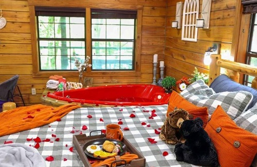 Angola Cabin | Heart Shaped Jacuzzi in main bedroom overlooking Fox Lake! Free Kayaks & Bikes