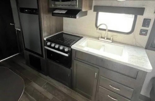 Oshkosh RV Rental | Hidden Haven Camper Beach, Pond, Firepit