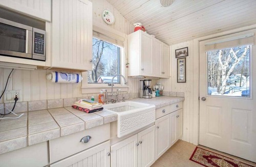 Walloon Lake House | Historic cozy cottage in Walloon Lake village close to Boyne Mountain skiing!