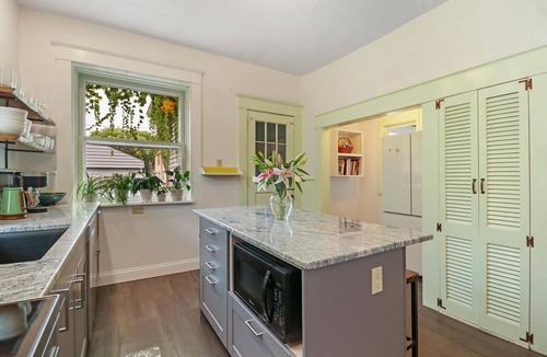 Racine House | Historic house on tree lined red brick street of historic homes.