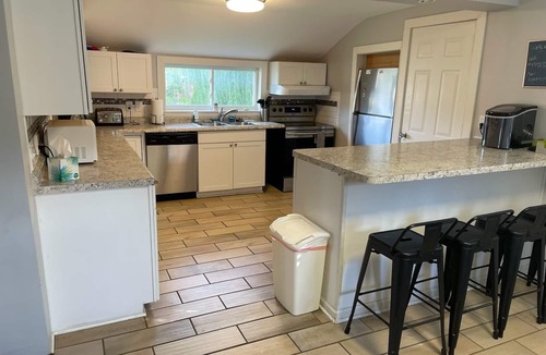 Elk Rapids House | Huge corner lot, home is a 2-minute walk to beach, playground, and park
