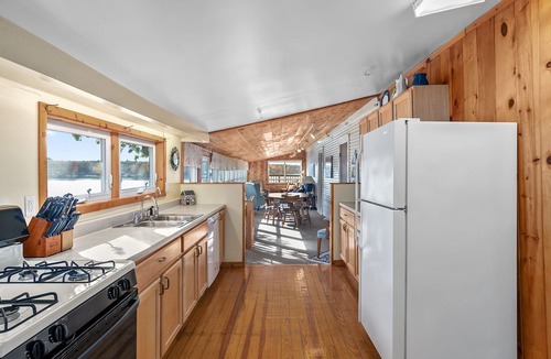 Newaygo House | Huge lake house. 3 levels. 9 bedrooms. Great for groups. Large beach. Fire pit.