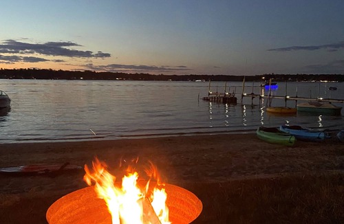 National City Cottage | Lake/beach front property with kayaks, pedal boat, & row boat, near Tawas Bay