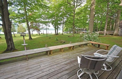 Empire House | Lakefront home on Little Glen Lake with fireplace, deck, gas grill, and firepit