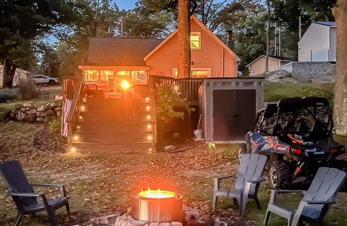 Mecosta Cottage | Lakefront Retreat | Hot Tub, Firepit, Kayaks, Dock & Spacious Outdoor Living