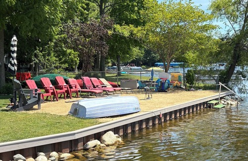 Grand Junction House | Large Lakehouse w Private Beach~Hot Tub~Tiki Hut~Game Rm~Gym~Mini-Golf~Dogs OK!