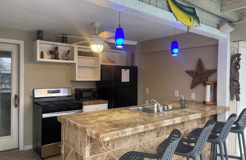 Jamaica Beach House | Lowest prices ever! 8 BR 6 BA pool, hot tub on water proms