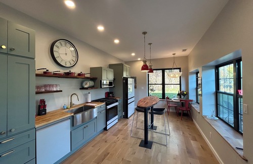 Nunica House | New renovation retro-Modern 1960s Service Station Fireplace 100″ TV garage