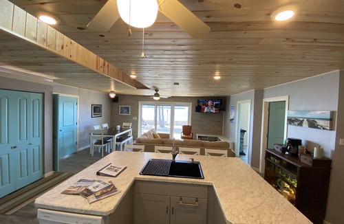 Little Sturgeon House | Prime sunsets, great kayaking, huge yard, volleyball court, and free firewood