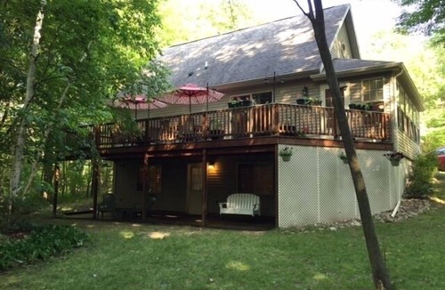 Mears House | Privacy and Luxury await! Fire Pit Patio, Large Outdoor Deck, and Heated Pool.