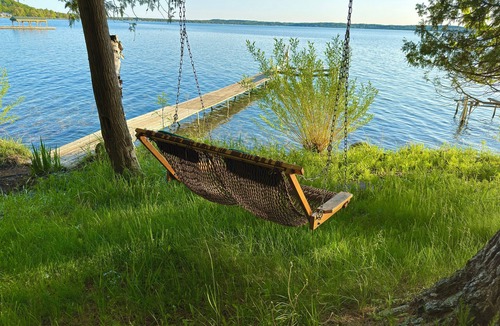 Alden Cottage | Private Sandy Beach on Torch Lake Cottage + Guest House Walk to Alden
