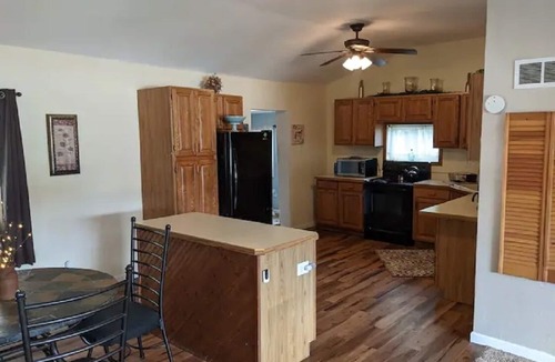 Colton Cottage | Riverfront Cottage with Hot Tub, Kayaks, Canoes, & Fishing Boats!