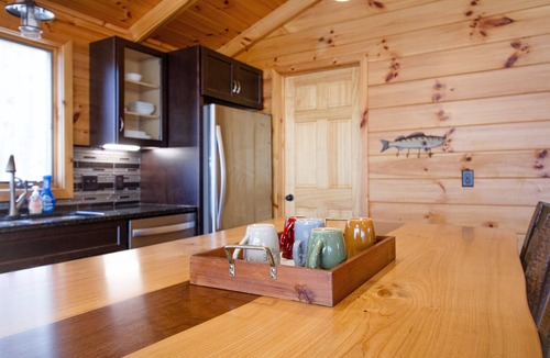 Evart Cabin | Riverfront | Hot Tub, Fireplace, Kayaks & Tubes