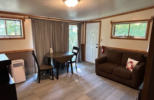 Sand Creek Cottage | Rustic cabins in secluded campground with lake access and woods to wander in.