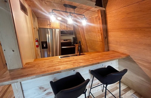 Racine Cabin | Rustic Riverside A-Frame Retreat: Secluded Charm.