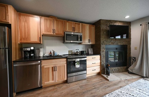 Mancelona Condo | Schuss Village golf, pool, sleeps 6. 2 baths wood fireplace, outdoor pool summer