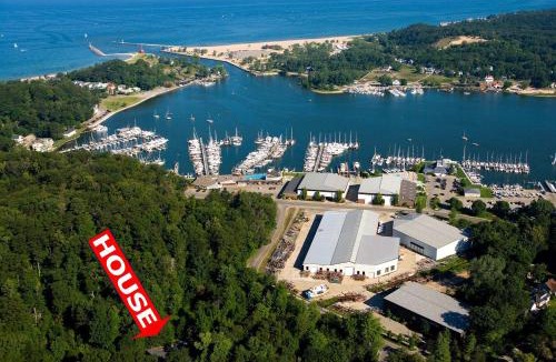 Macatawa House | Secluded Woodland Retreat Home with Creekside Deck Near Macatawa Beach in Macatawa, Michigan