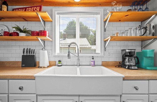 Paw Paw Lake House | Short Description: Lakewood Bungalow | Screened Porch 2 Baths Basement Hangout Walk to Lake Onsite Laundry