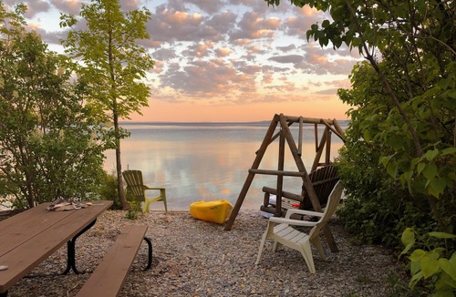 Omena House | Spacious And Peaceful Retreat On Grand Traverse Bay! Private Beach Front