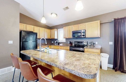 Douglas Condo | Stylish dog-friendly retreat with furnished deck, pool, & firepits