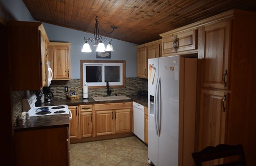 Traverse City House | The Bass Lake Lodge - Traverse City's year-round slice of lake life Heaven!