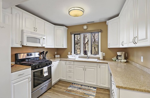 Fontana Condo | The Oaks Retreat |Abbey Springs Resort |Upper & Lower Living Rooms |Wraparound Deck |Pool |Beach